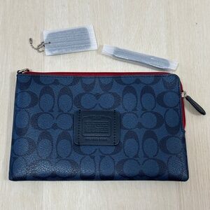 Coach monogram navy wristlet